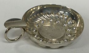 An early 19th Century silver wine taster.