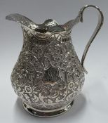 A fine quality Indian Kutch Kashmiri silver jug.