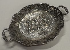 An embossed Continental silver tray with handles.