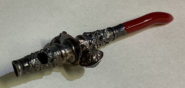 A silver toy rattle.