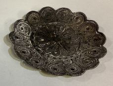 An Indian silver dish with filigree decoration.