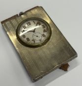 A silver mounted clock.