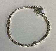 A child's silver heart charm bracelet.