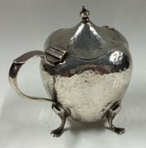 An Art Nouveau silver mustard pot.