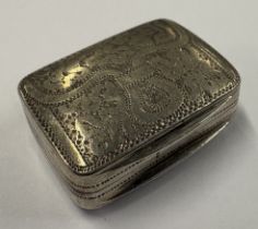A George III silver vinaigrette in the form of a purse.