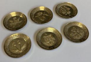 A good set of six miniature Continental silver plates.