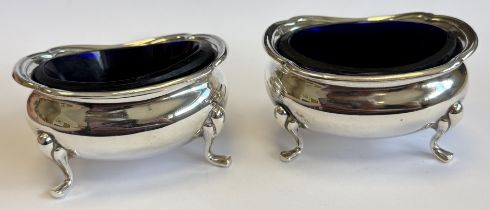 A pair of heavy Edwardian silver salts.
