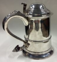 NEWCASTLE: An early 18th Century silver lidded tankard.