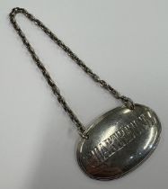 A rare Victorian silver decanter label for 'Chartreuse'.