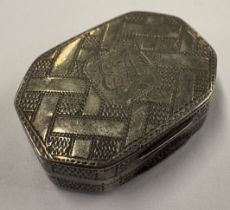 An octagonal George III silver vinaigrette.
