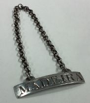 A rectangular William IV silver wine label for 'Madeira'.