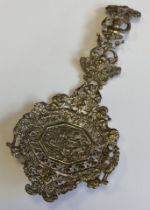 A heavy chased silver spoon.