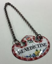 A rare 18th Century enamelled decanter label for 'Bénédictine'.