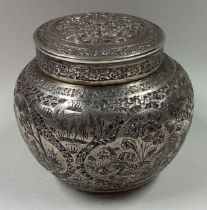 A fine 19th Century Persian chased silver tea caddy.