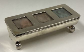 A Victorian silver triple stamp holder.