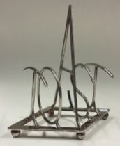 A silver-plated toast rack.