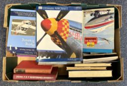 A box containing various aeronautic books and magazines.