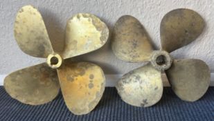 Two large brass propellers.