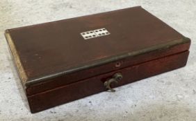 A small cased travelling dominoes set.