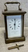 A small brass carriage clock.