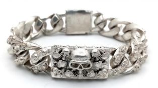 Of Buddhist Interest: A Tibetan Silver, Gents’ Bracelet With Skulls. Length: 23cm, Weight: 114g