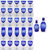 Suite of Blue Overlay Crystal Glasses & Decanters
