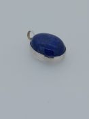 Silver set with lapsus lazuli stone