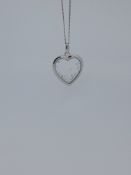 Silver Heart Shaped Pendant With Floating Stones