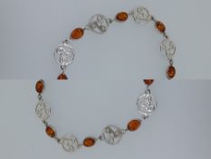 Silver and natural amber bracelet with alternating Celtic links