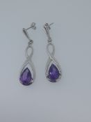 Silver drop earrings set with AAA amethyst pear cut stones