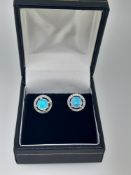 Silver and Synthetic Opal Stud Earring With CZ Halo