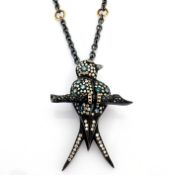 An Exquisite Bird Necklace Detailed With Brilliant Diamonds and Gold On Silver.