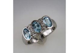 A Restored 3 Stone Aquamarine and Diamond Ring