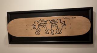 Keith Haring (1958–1990), “Untitled.” Three figures, 1985. Black Marker On Skateboard Deck. Signe...