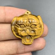 Hand Carved Natural Tiger Eye Tiger Pendant.