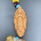 Hand Carved Wooden Buddha With Carnelian Carved Beads