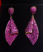 A Pair of Gilded Earrings Loaded With Lab Created Round Cut Rubies