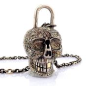 An Exquisite Convertible Clasp Skull Necklace Embellished With Gold and Diamonds On Silver
