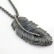 An Exquisite Feather Necklace Detailed With Brilliant Diamonds and Gold On Silver.