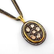 An Exquisite Necklace Intricately Detailed With Brilliant Diamonds and Gold In Silver
