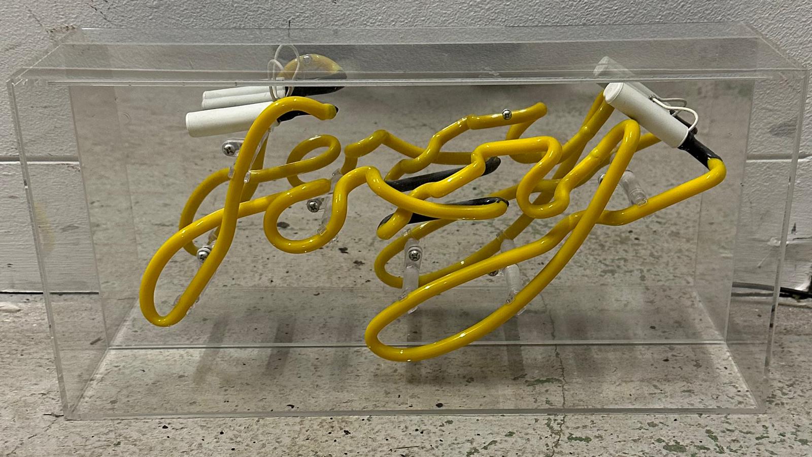 A novelty yellow neon sign "Foxy"