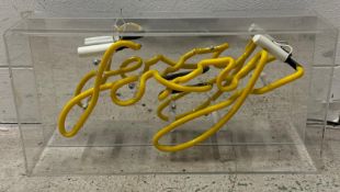 A novelty yellow neon sign 