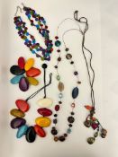 A collection of vibrant costume jewellery, multi pebble style necklaces, beaded Bohemian styles etc