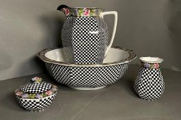 A wash jug and bowl along with a vase and a lidded powder puff bowl by Grimwade and Winton(AF)