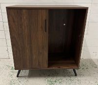 A contemporary side cabinet with single cupboard and parallel shelving on splayed legs (H84cm