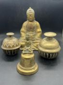 A Buddha and three bells, two elephants claw bells and one other