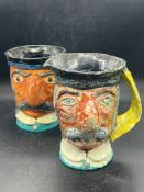 Two folk art character jugs