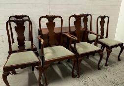 A mahogany drop leaf dining table and six dining chairs to include two carvers upholstered in green.