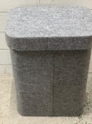 A grey felt laundry bin
