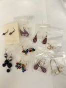 A collection of costume jewellery earrings including Christmas themed baubles